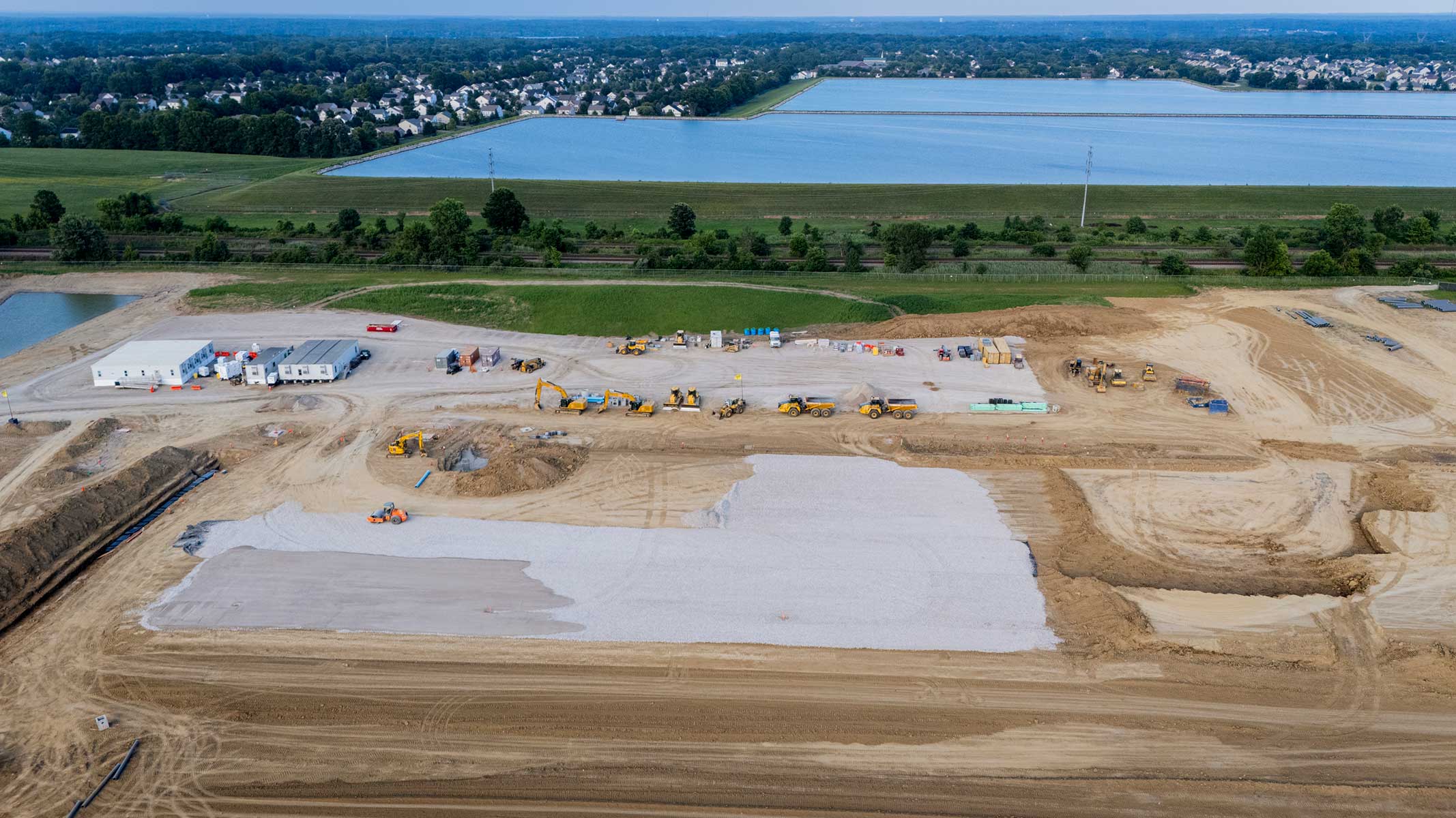 Construction workers on site at a large data center project.