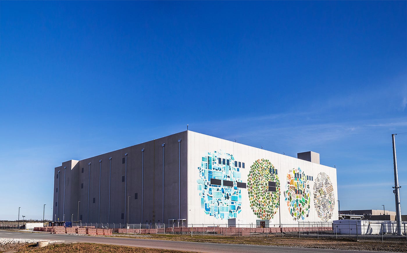 A Google data center exterior bearing a large hand-painted mural. Photo: Google.